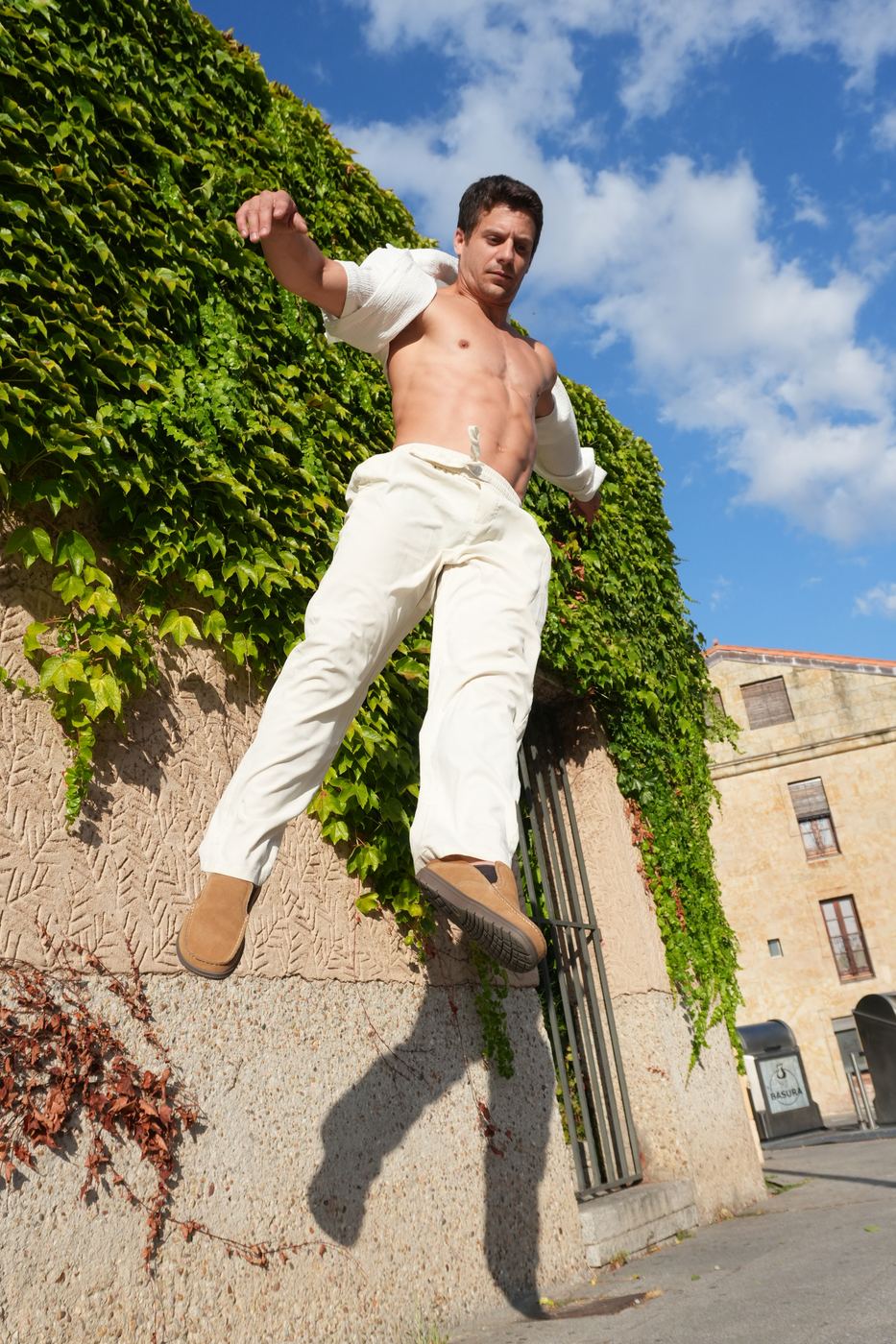 Jumping down an ivy-covered wall